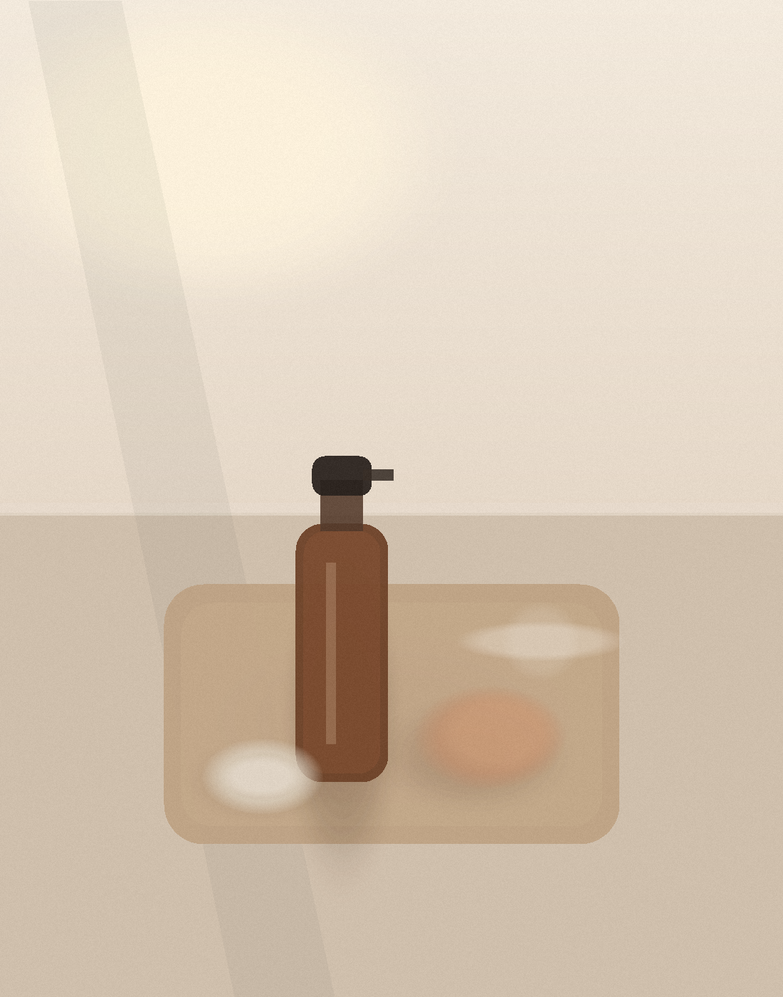 A vanity tray with an unlabeled mist bottle, a soft tanning mitt, and a small glass dish in warm morning light.