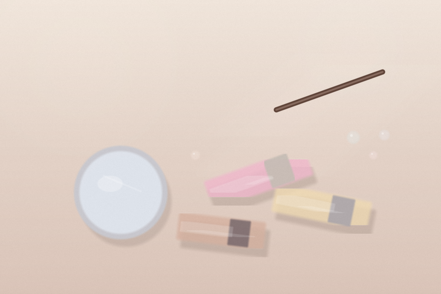 A warm-toned beauty still life with three pearlized lip gloss tubes, a slim brown lip liner, a silver compact mirror, and a few glassy beads on a cream vanity surface.