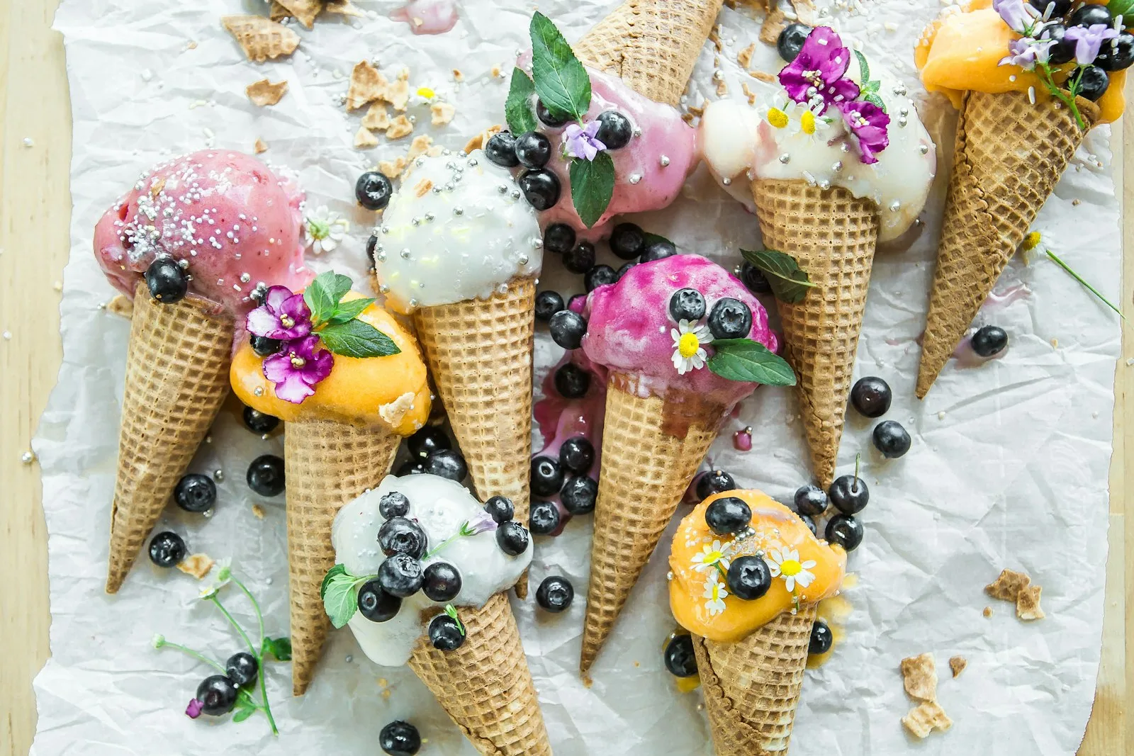 Scoops of colorful frozen dessert in bowls