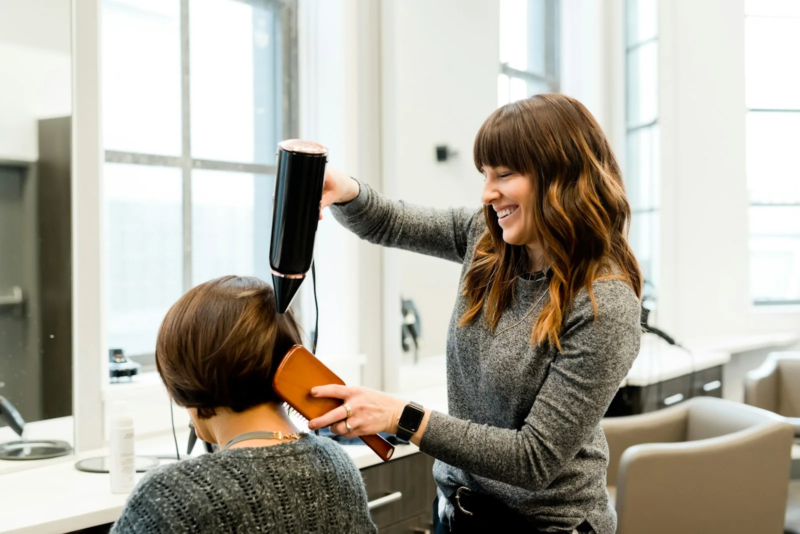 Salon chair with haircut tools and mirror